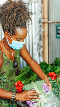 Woman Putting the Cauliflower in the Plastic