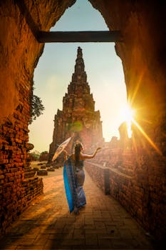 Woman Wearing Blue Dress With Umbrella during Sunset